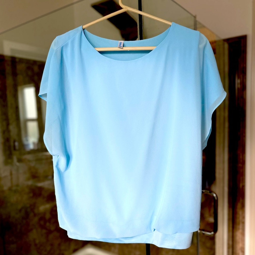 Beautiful blue, flutter sleeve, banded bottom blouse